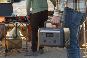 Sasquatch Outdoor 600W Portable Power Station Hand Held by Some Guy