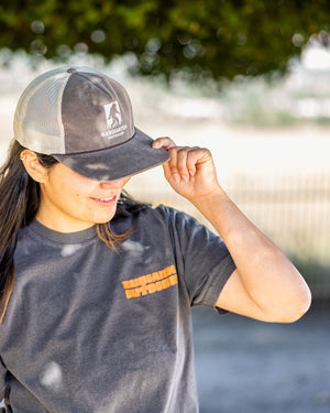 Sasquatch Outdoor Black Hat Covering Eyes Tilted Down Onsite Lifestyle with Sawl