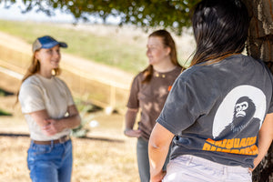 Sasquatch Outdoor Pepper Shirt Back with Logo Onsite Lifestyle with Trio